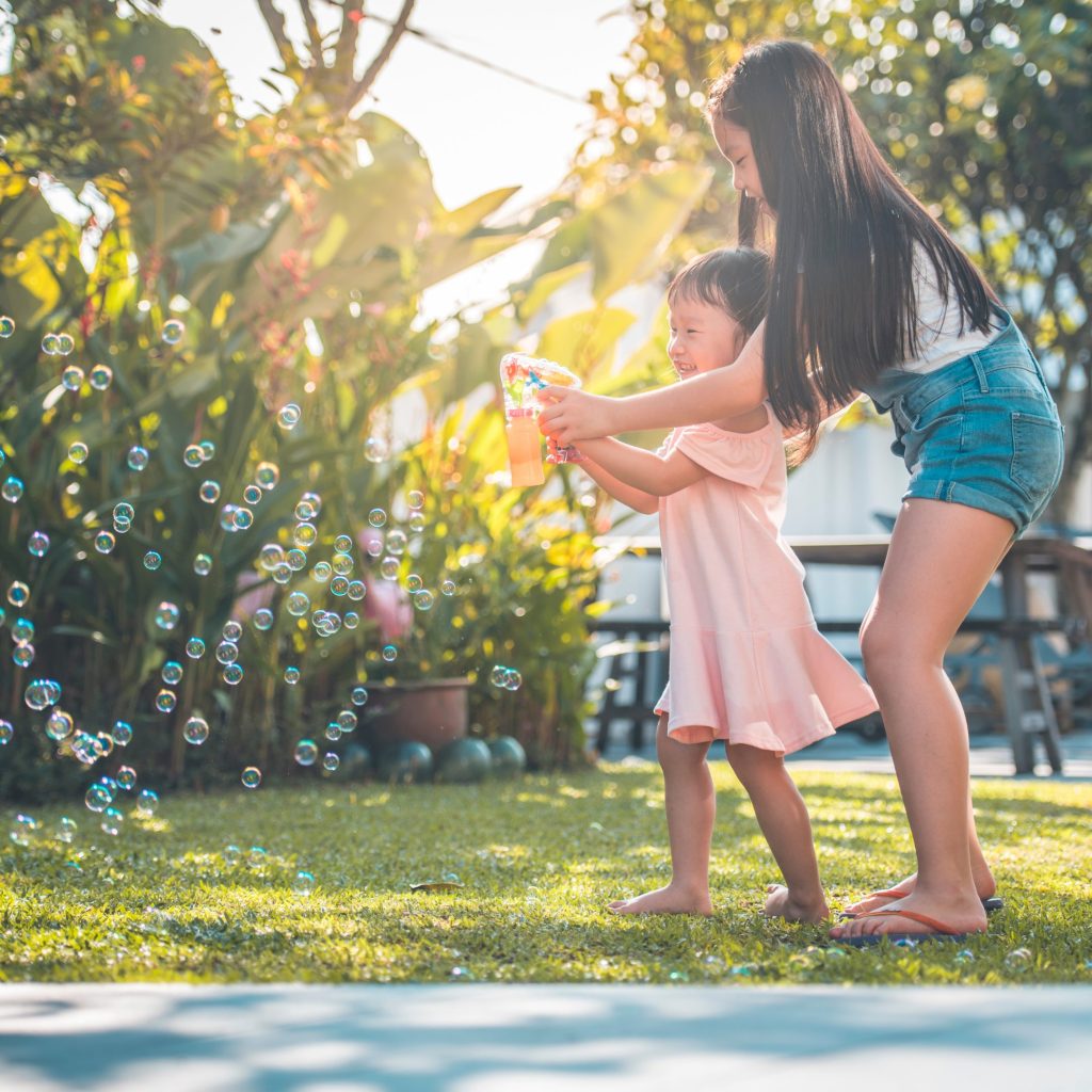 Girls playing with bubbles Girls playing with bubbles
